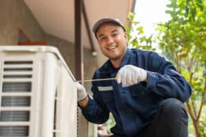 man looking at camera fixing hvac